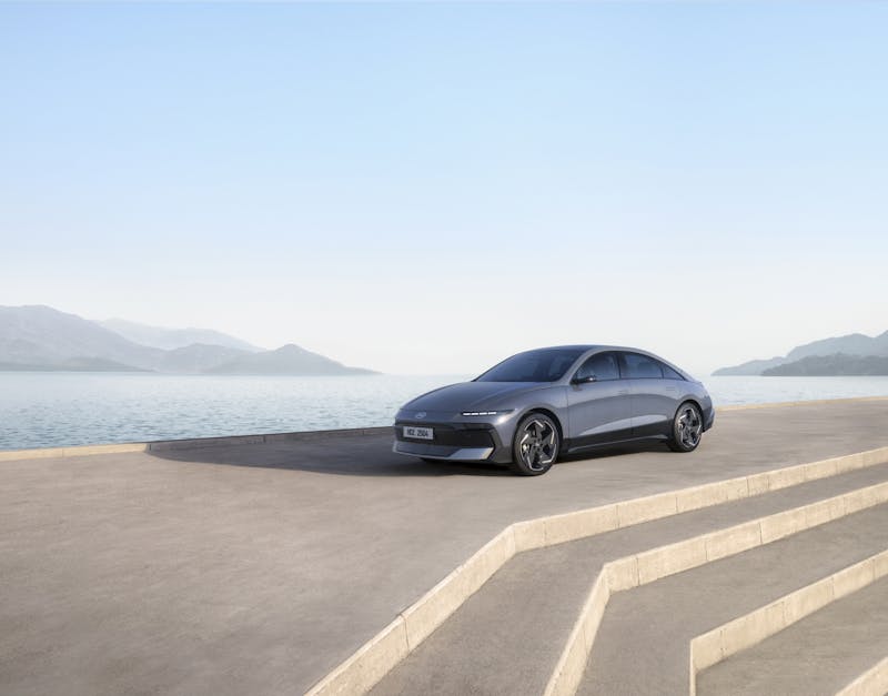 Hyundai IONIQ 6 parked with the sea in the background.